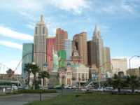 Faux skyscrapers and Statue of Liberty with real roller coaster